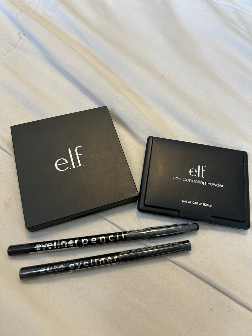 Elf Bronzer and Tone Correcting Powder and Two L.A. Colors Eyeliner Pencil